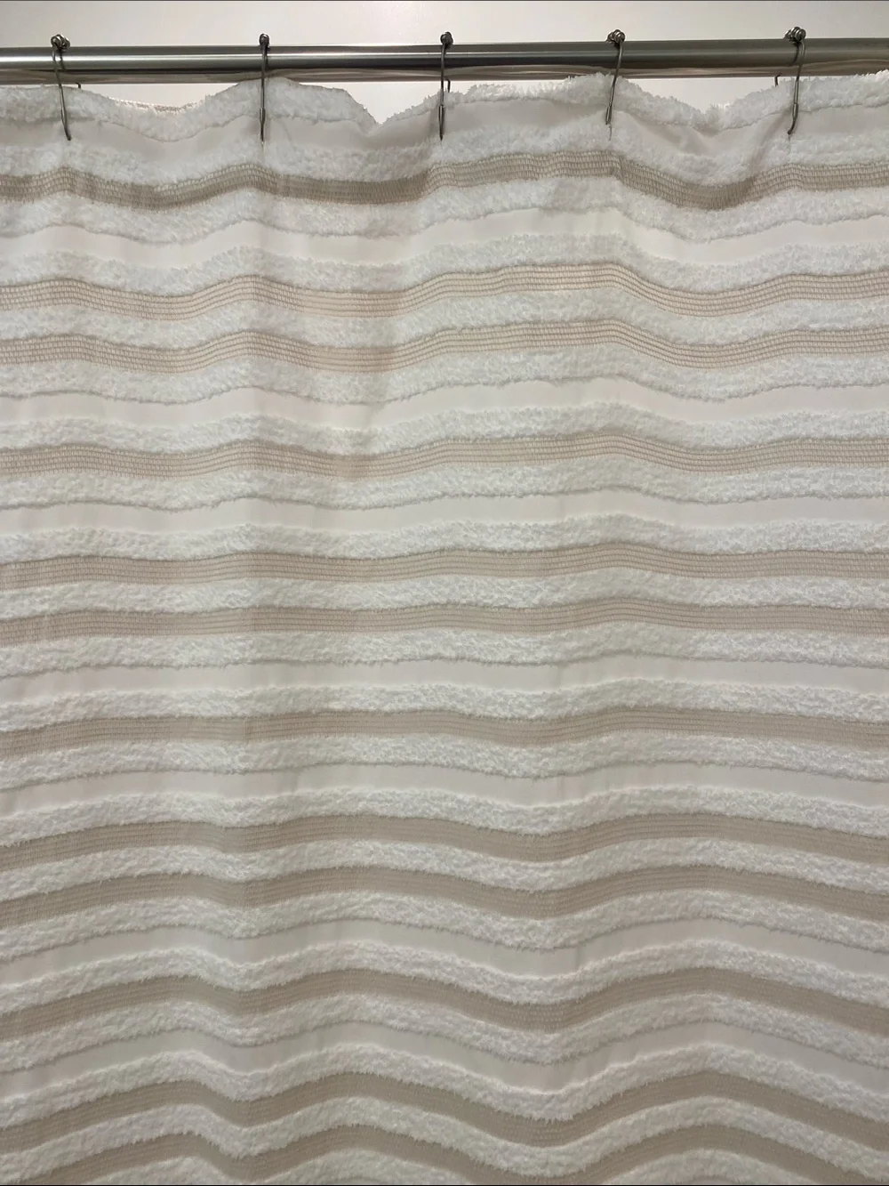 Cream and white striped shower curtain